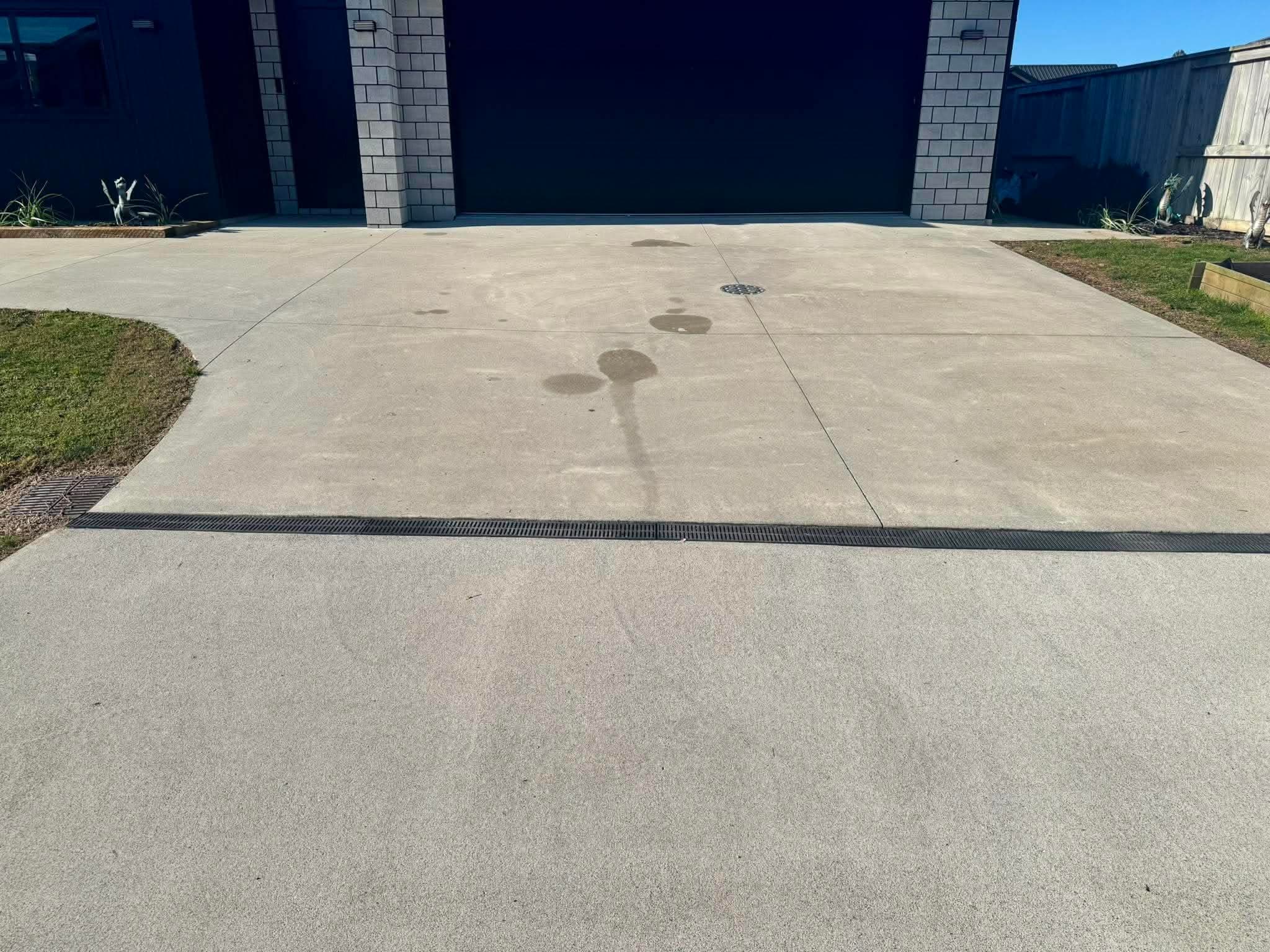 Freshly washed entrance concrete with a clean, wet sheen