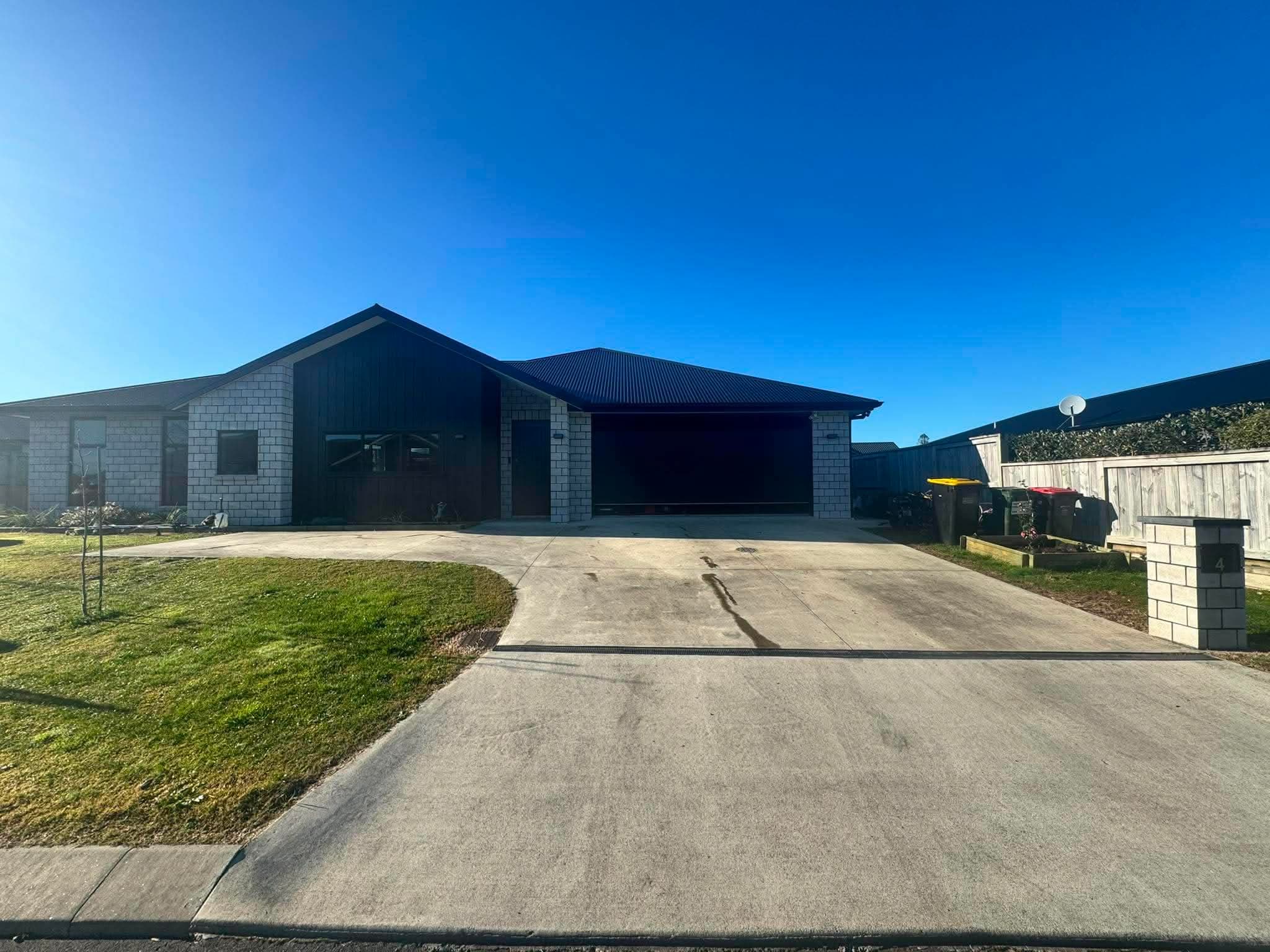 Tidy modern home with mown lawn and clean drive